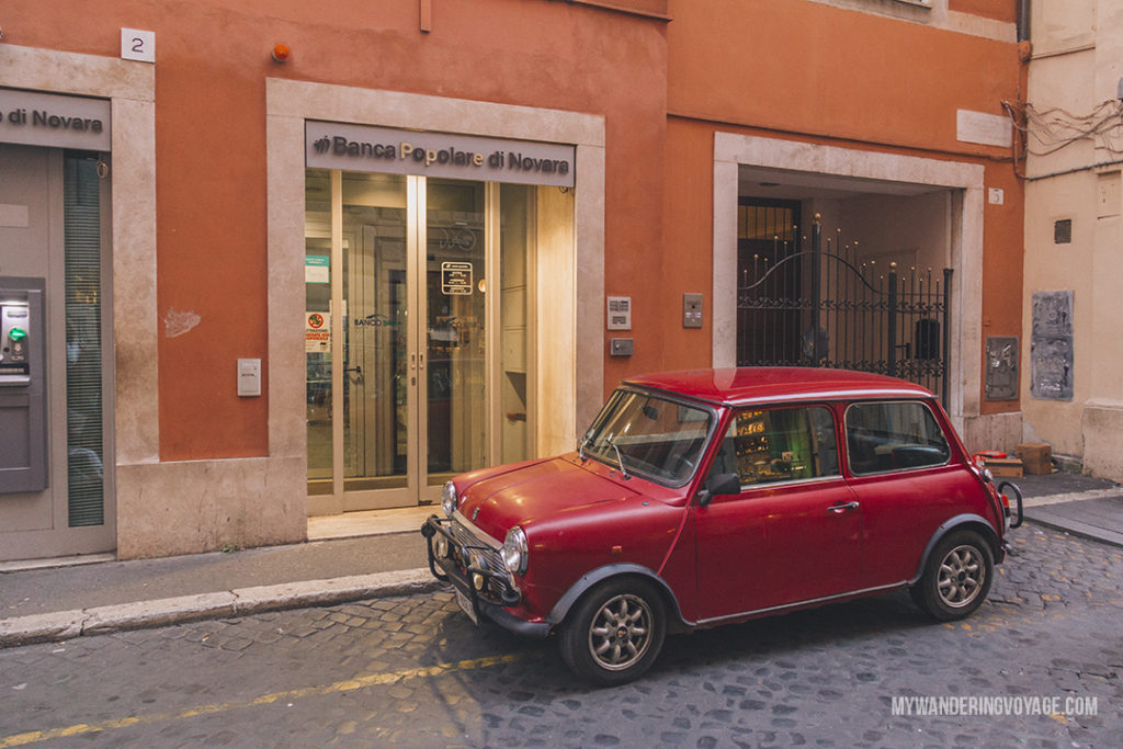 little red car on Rome street | With these 23 mistakes to avoid in Rome, Italy, you’ll be a seasoned traveller before you even land in the airport. | My Wandering Voyage travel blog #Rome #traveltips #travel #Italy