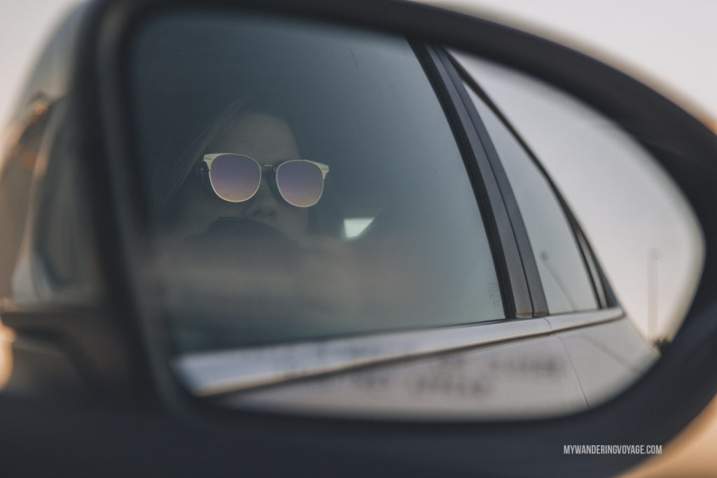Sunglasses in the car side mirror | When road trip season hits, don’t be caught unprepared. Make sure you have everything you need with this road trip packing list for a successful and enjoyable trip | My Wandering Voyage travel blog #travel #roadtrip #packing #USA #Canada