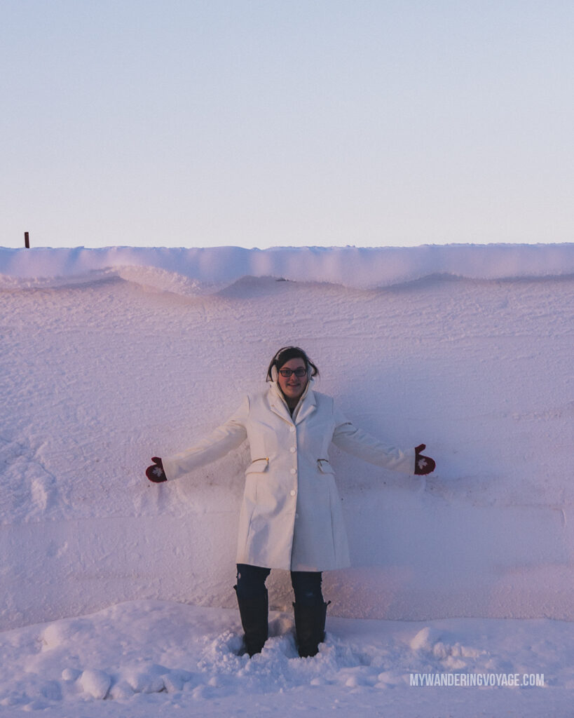 winter in Ontario, person standing in front of seven foot snow bank