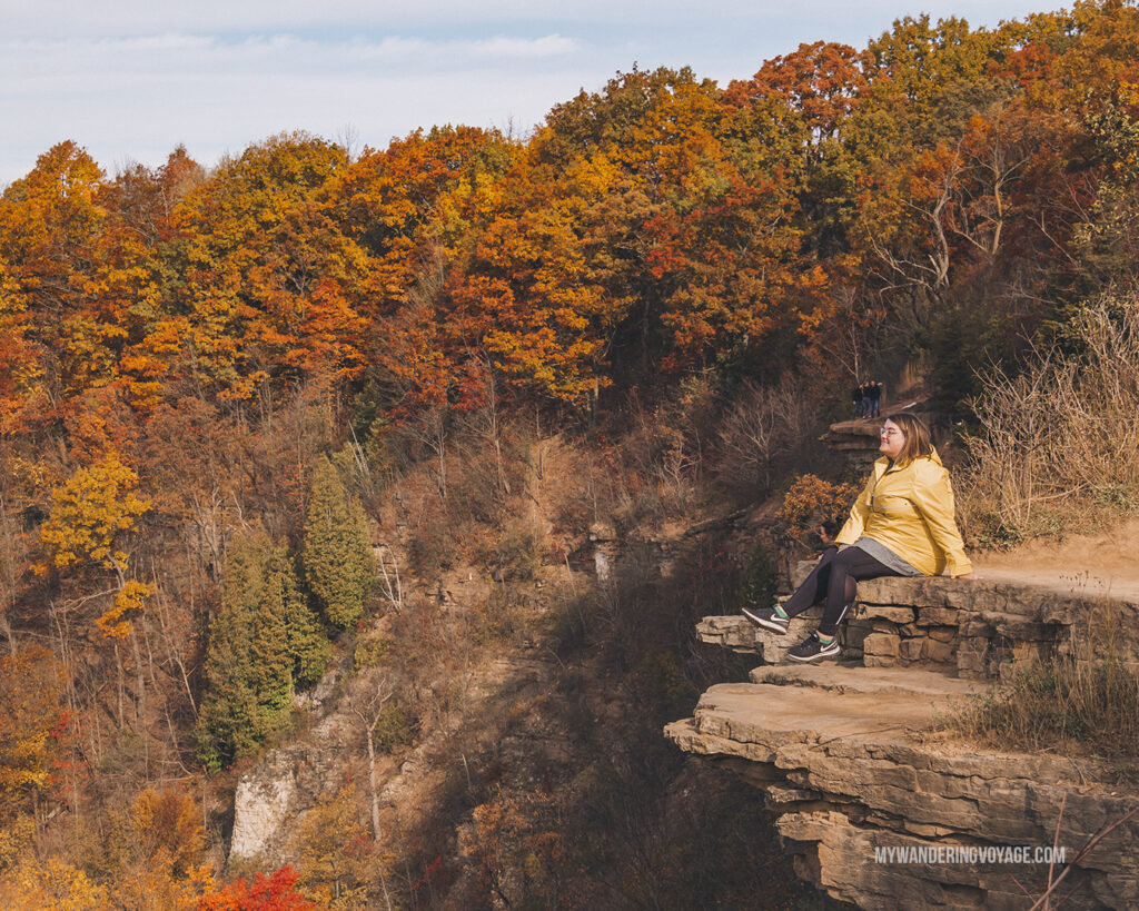 Woman sitting on Dundas Peak | Hiking the Bruce Trail: 14 side trails to explore | My Wandering Voyage travel blog