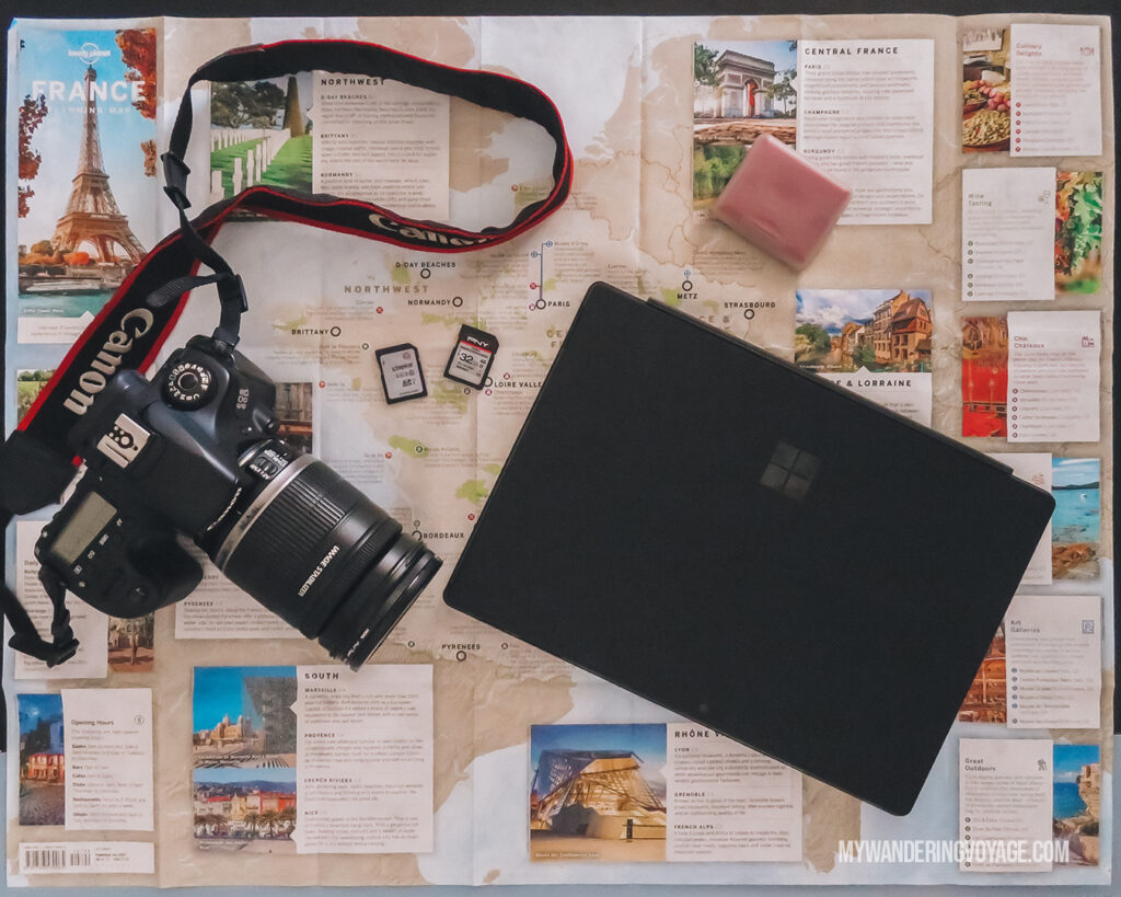 Camera and Laptop with map | Best Way to Organize Your Travel Photos | My Wandering Voyage