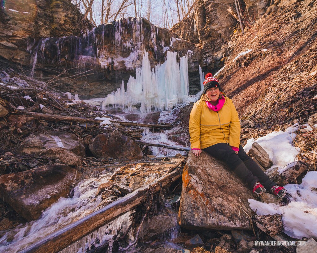 Woman and frozen waterfall | Hiking the Bruce Trail: 14 side trails to explore | My Wandering Voyage travel blog